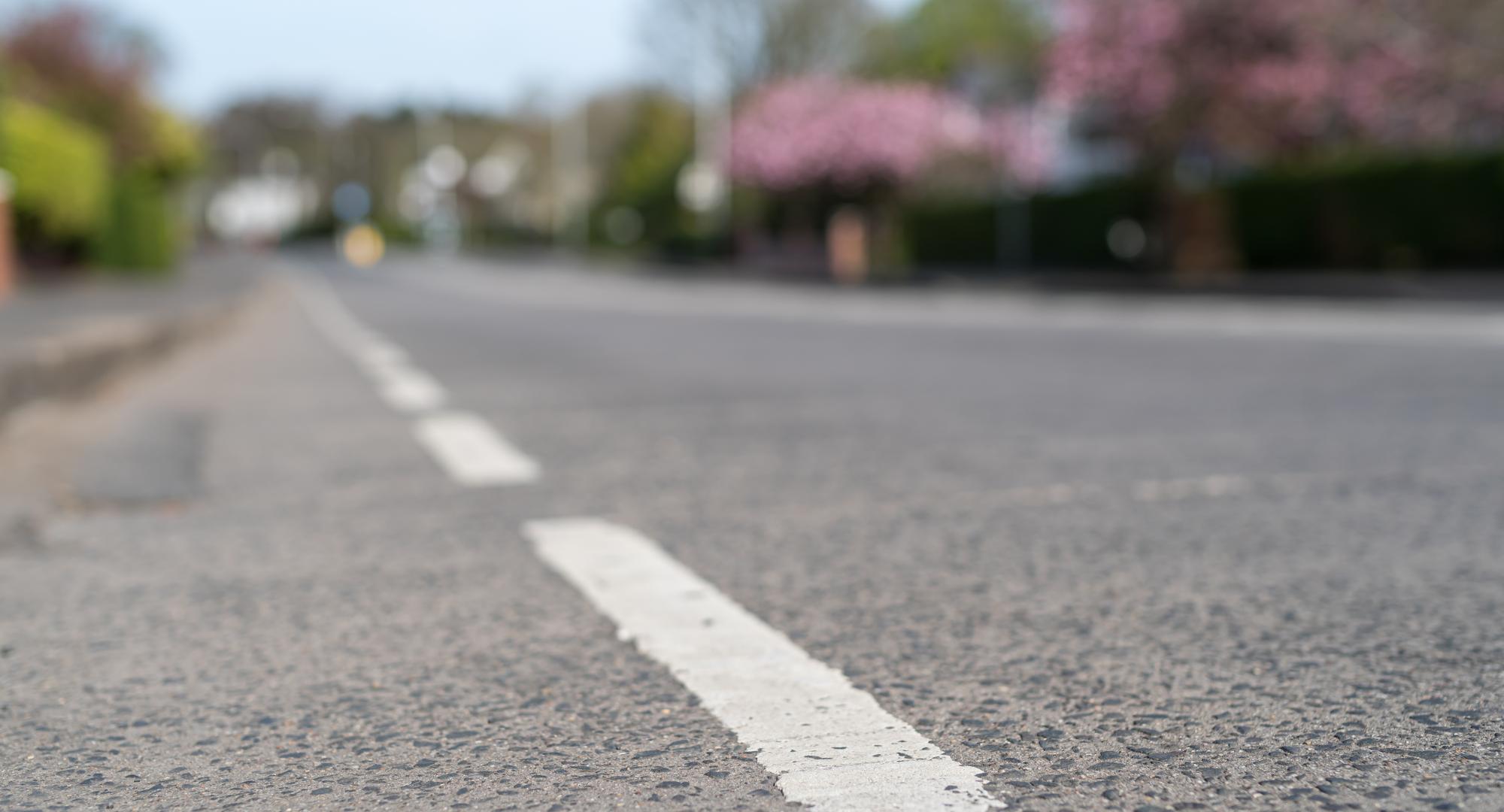 Road markings on an empty suburban road