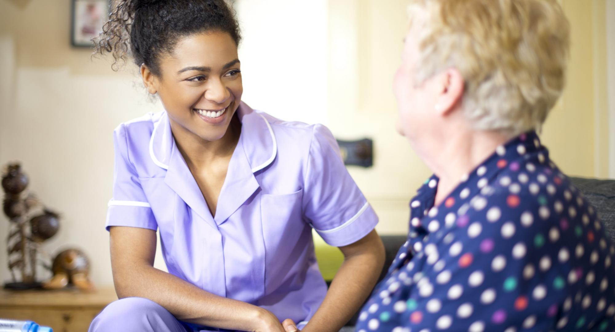 care worker on a house call with an elderly lady