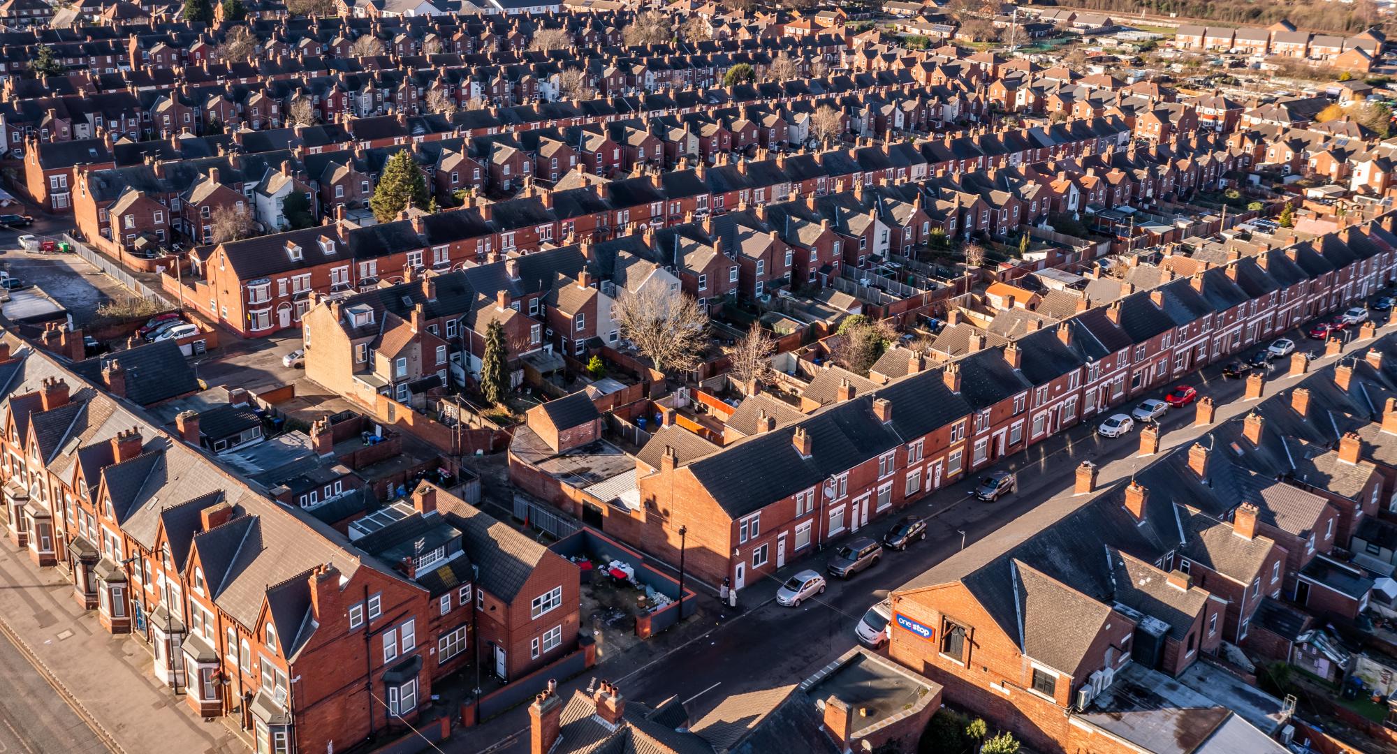 Aerial view of the rooftops of a block of back to back terraced houses in the North of England