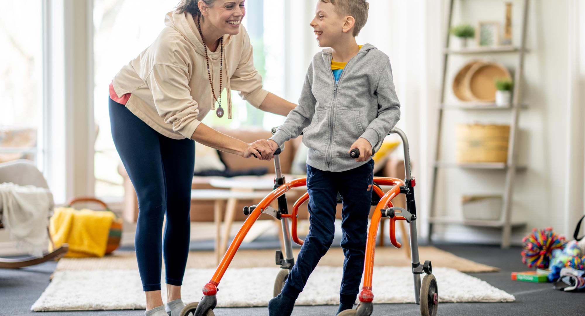 Disabled child with his mother at home