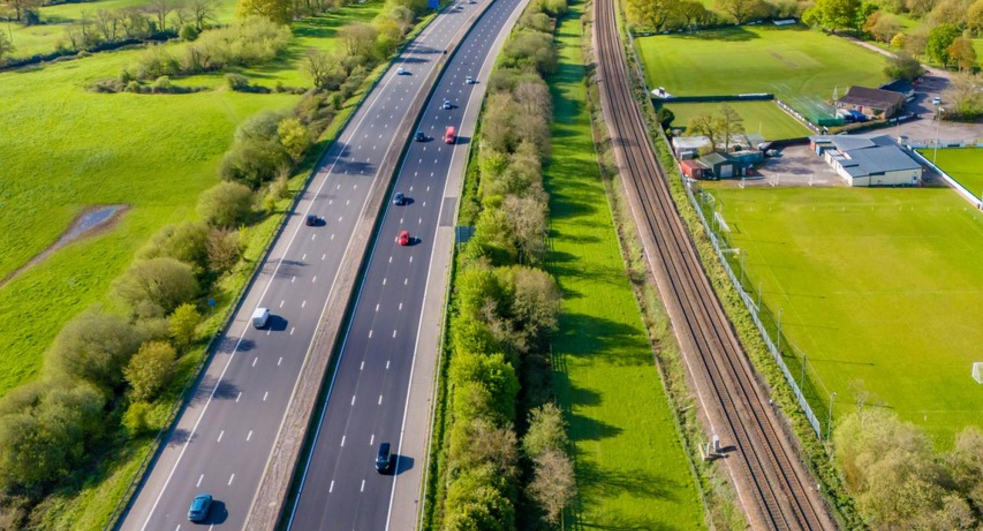 Aerial shot of the M5 motorway and a railway line