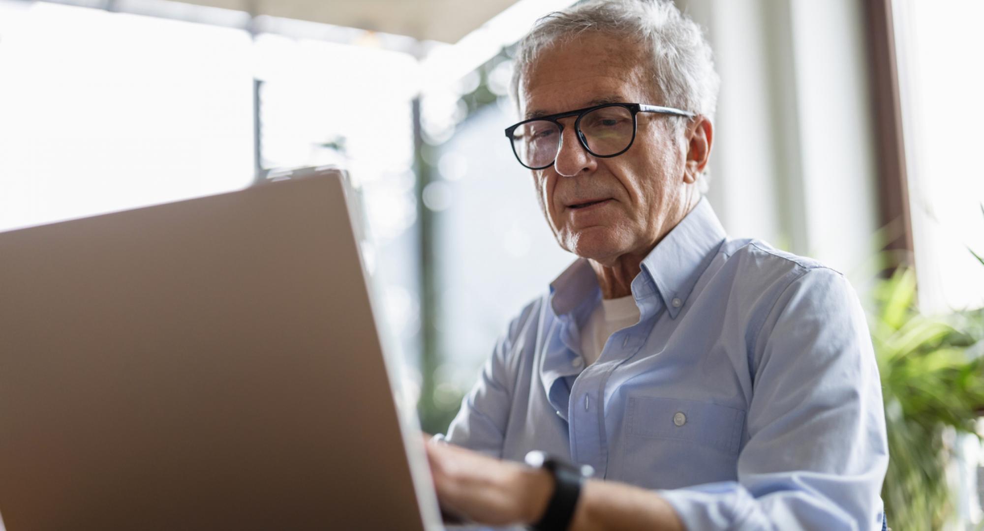 Senior man using laptop
