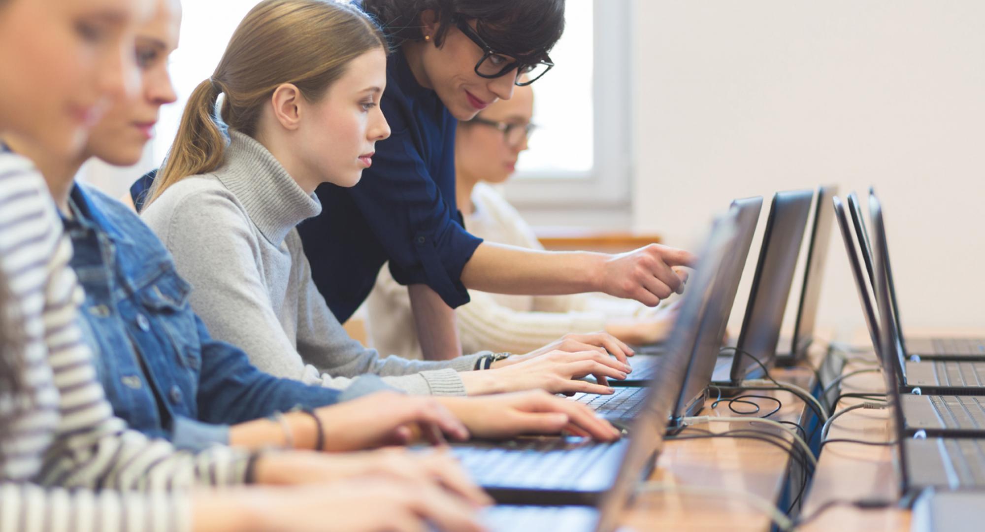 Young female student learning digital skills