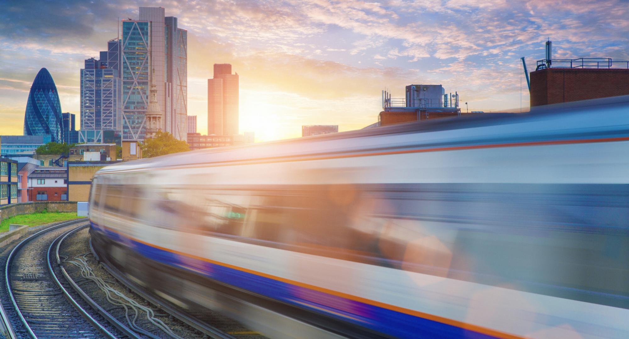 London Overground with the City of London skyscrapers in the background