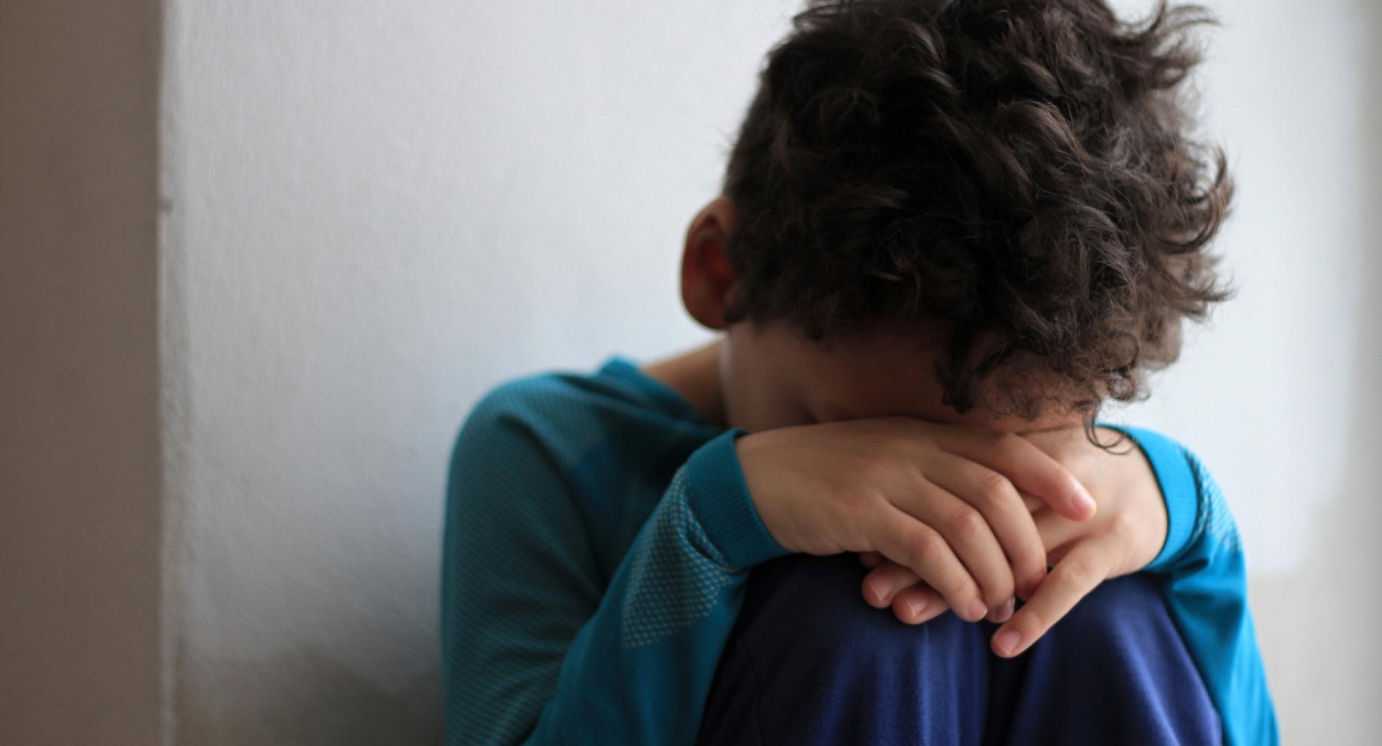 An upset child in poverty