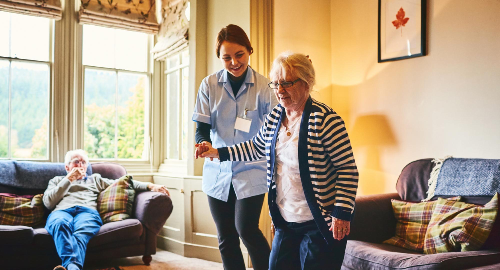 Nurse supporting woman with care needs