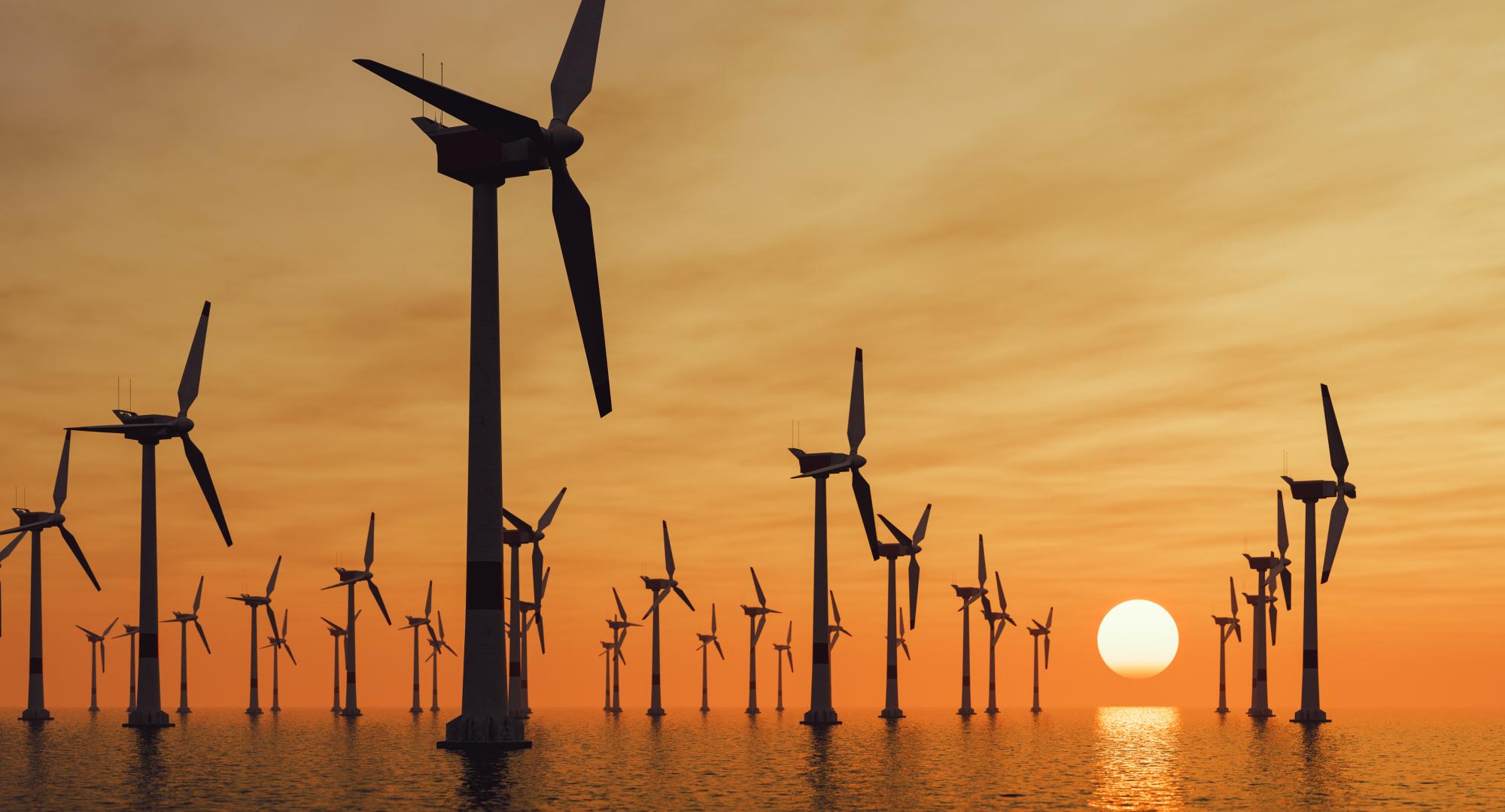 Offshore wind turbines at sunset