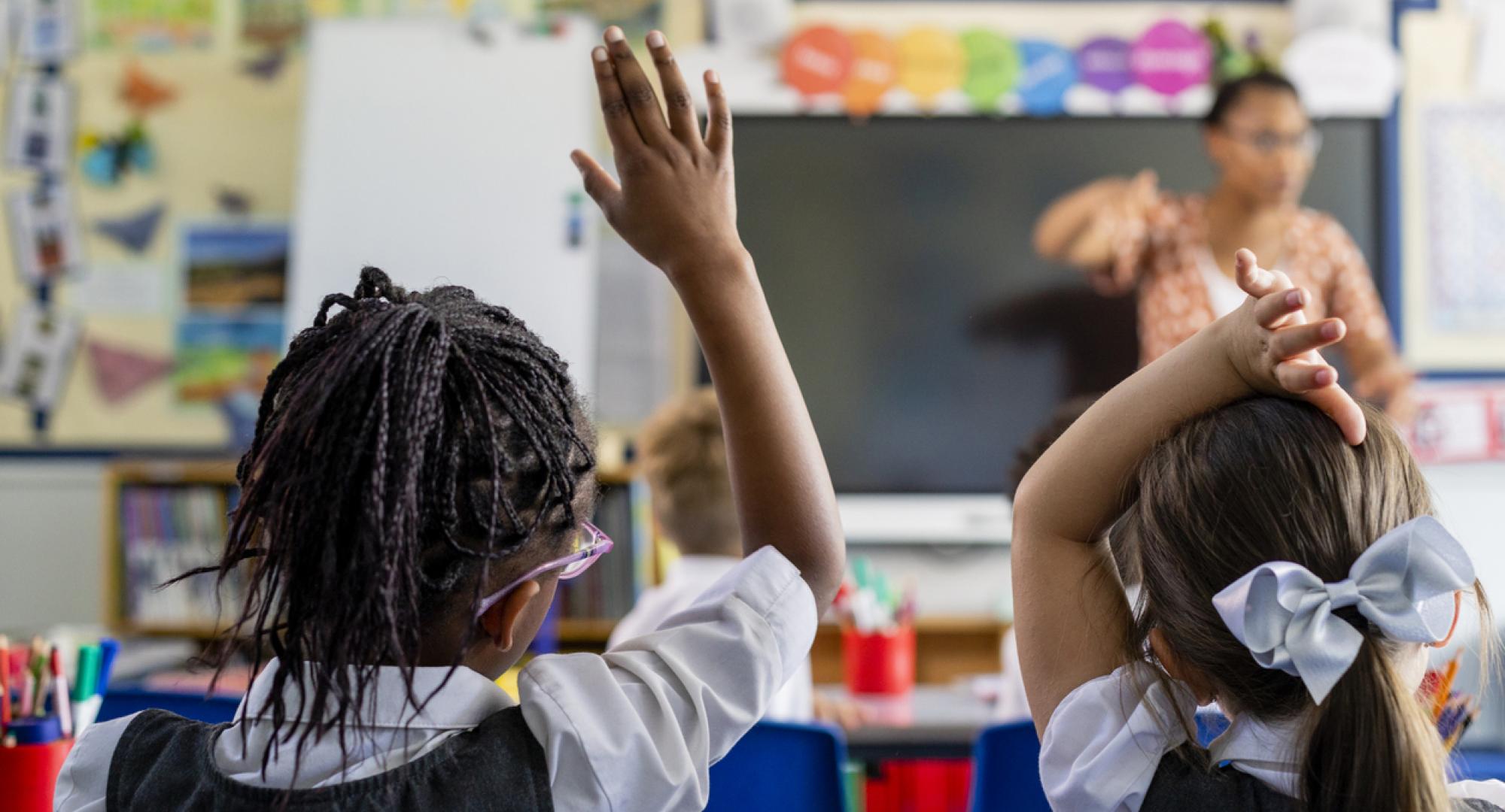 Primary school students sitting in a classroom
