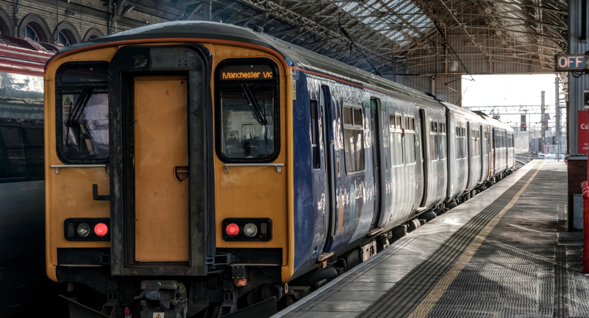 Train from Northern leaves the station on way to Manchester