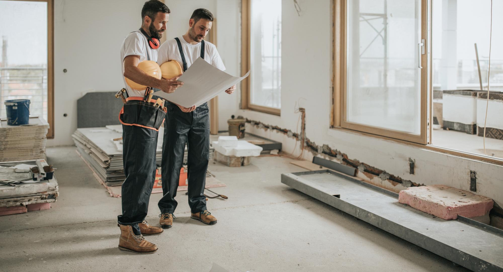 Two builders working on a new house
