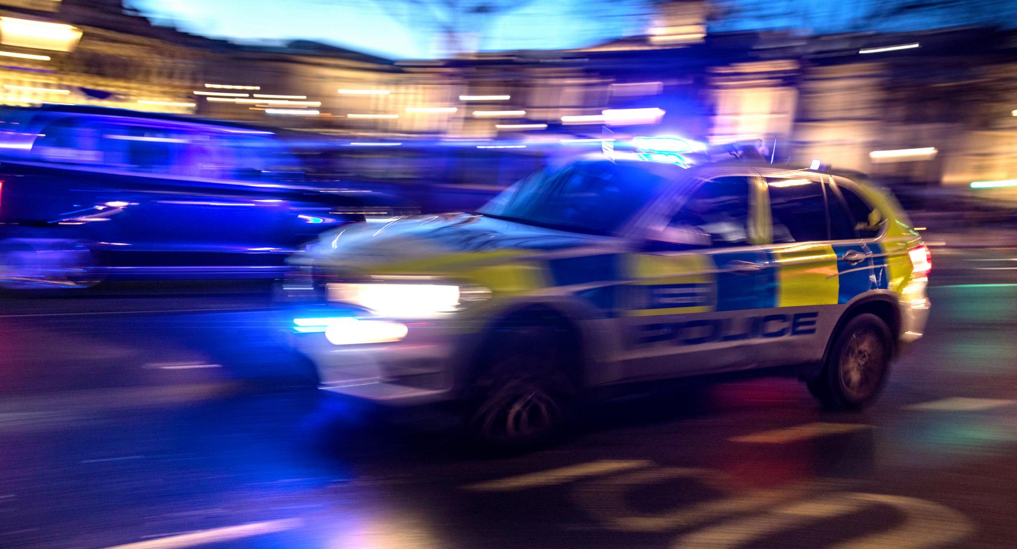 Police car responding to crime in London