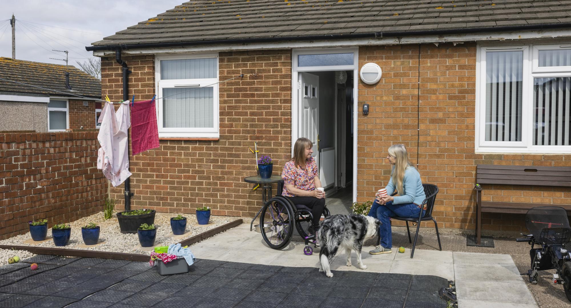 Two women catching up at supported housing