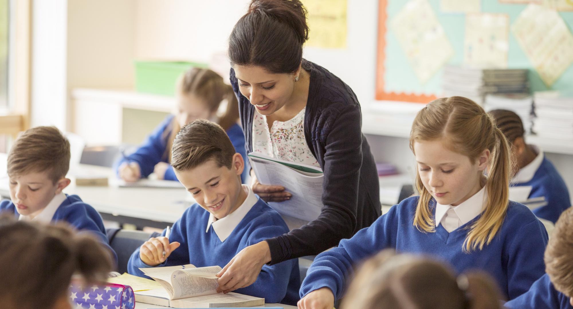Female teacher with her pupils