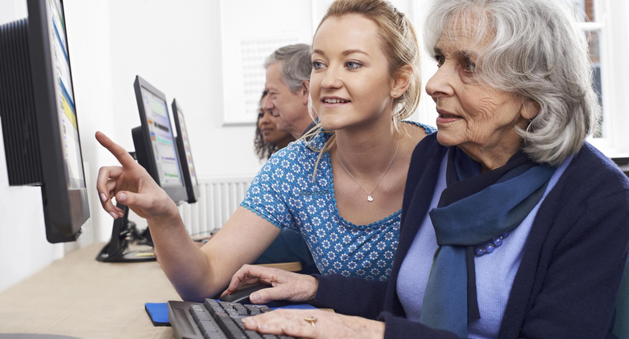 Senior woman learning to use computer
