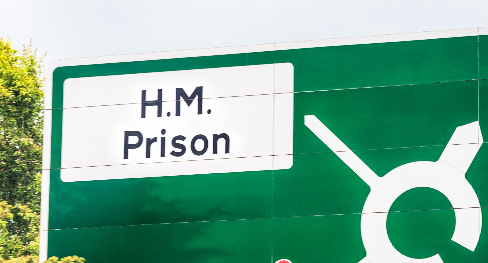 HM Prison road sign