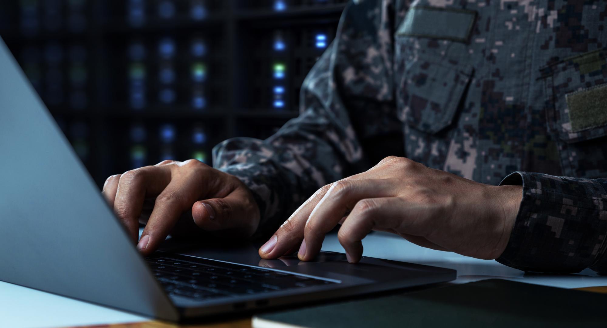Soldier working on computer
