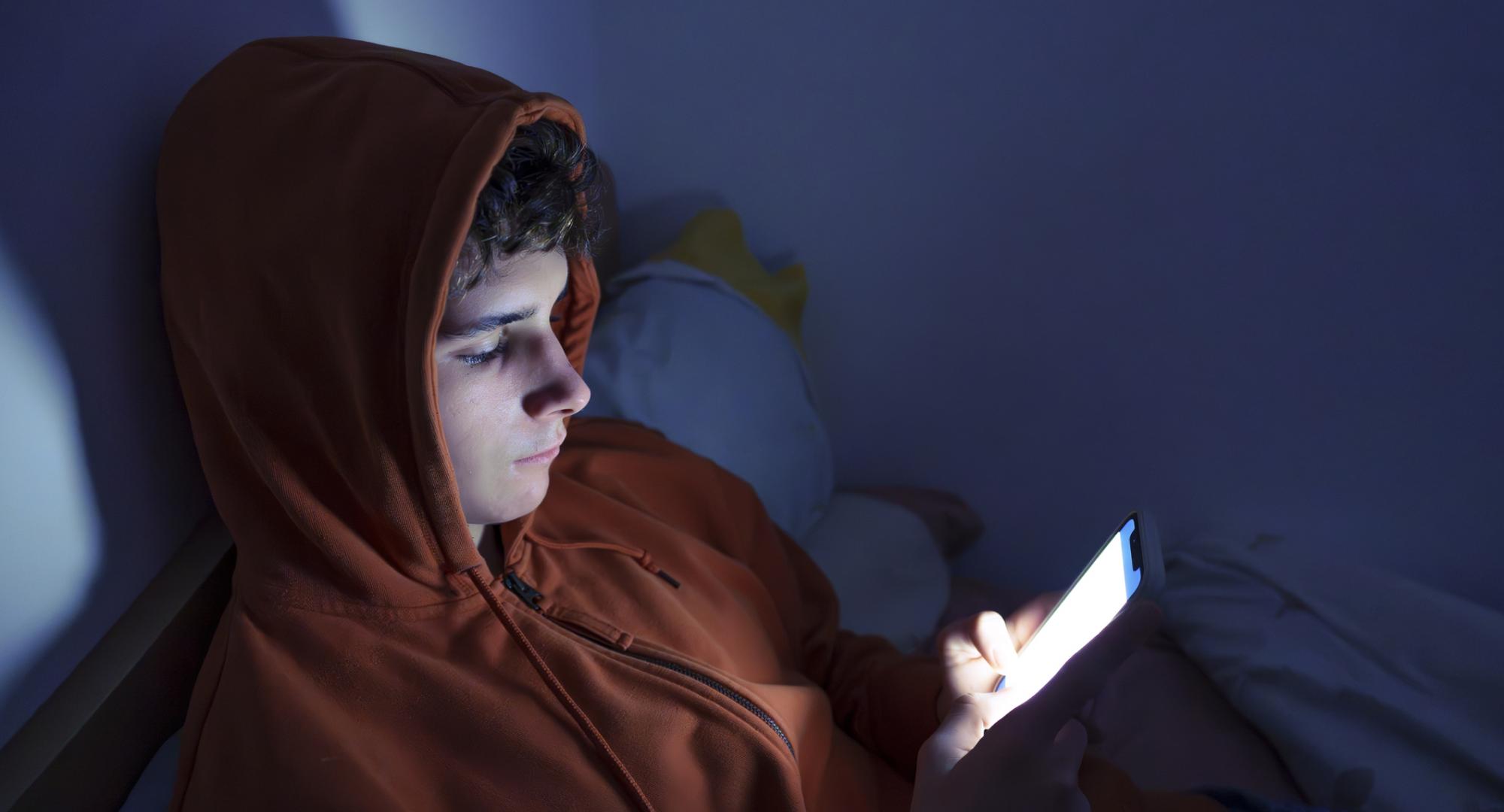 Teenager using a smartphone