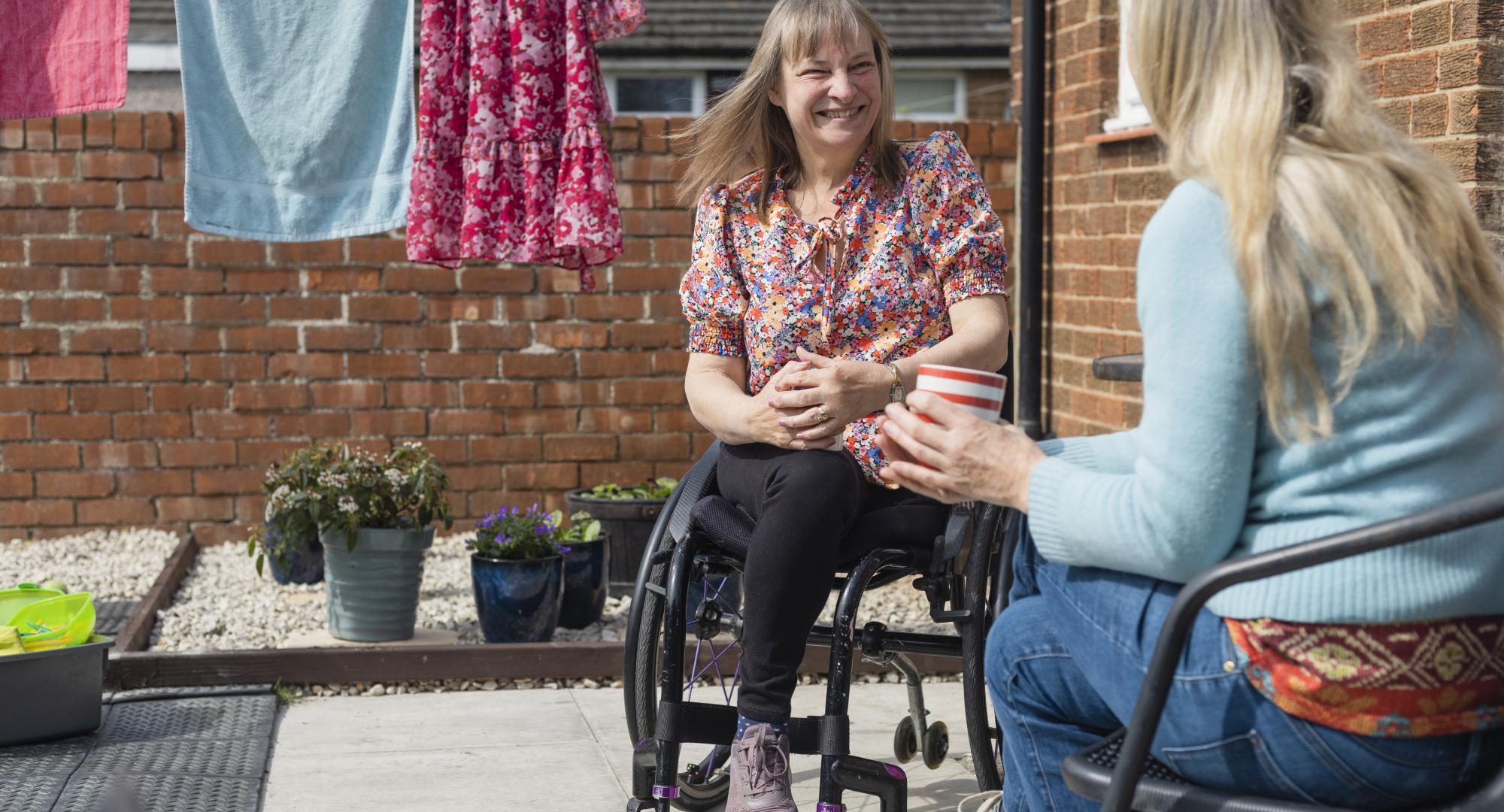 Woman in a wheelchair at home