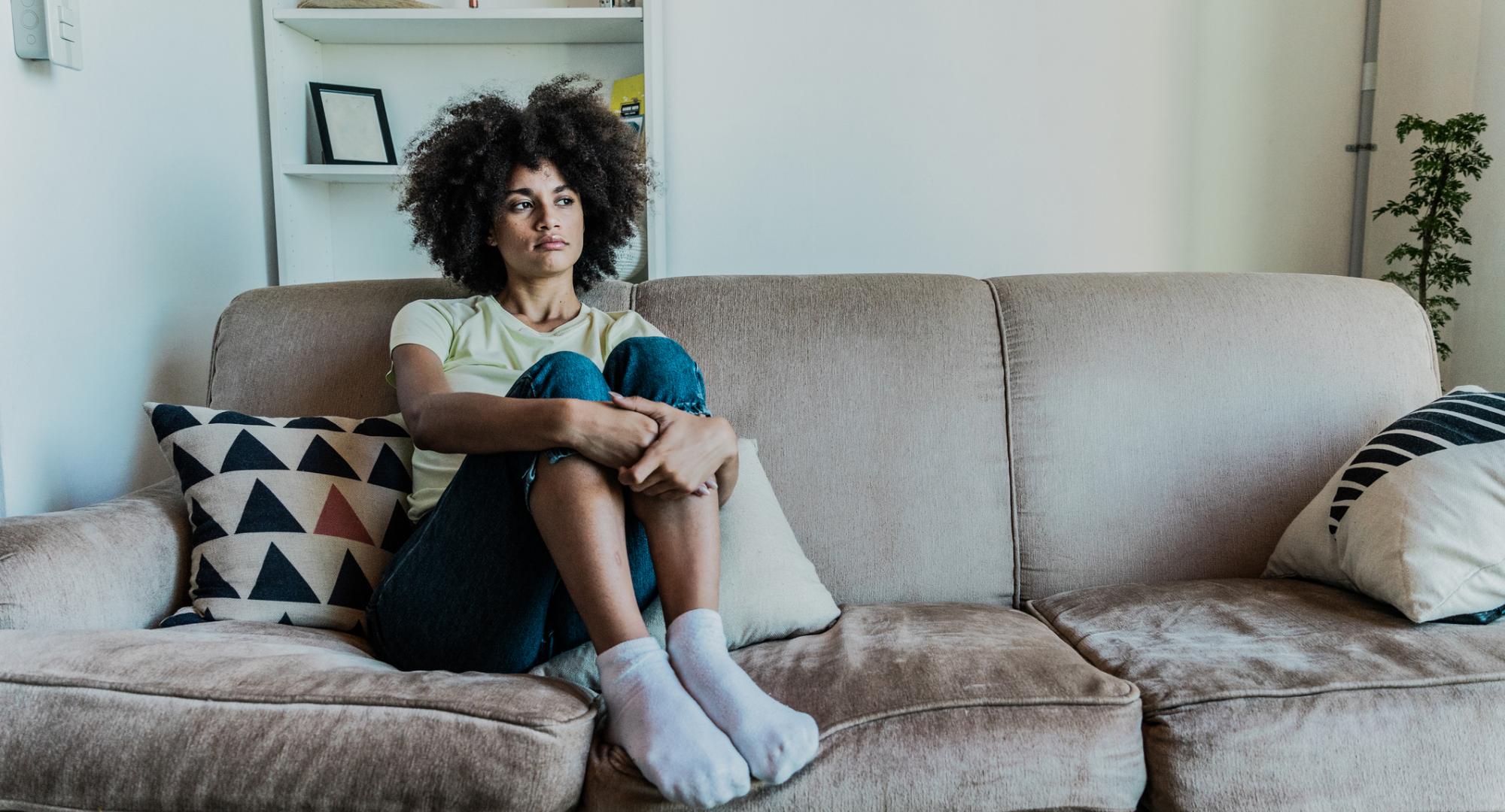Young person sat at home