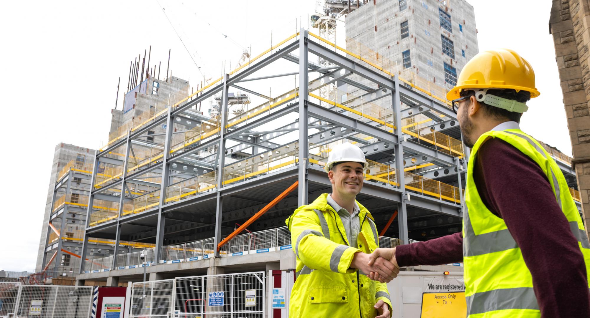 Men shaking hands at work