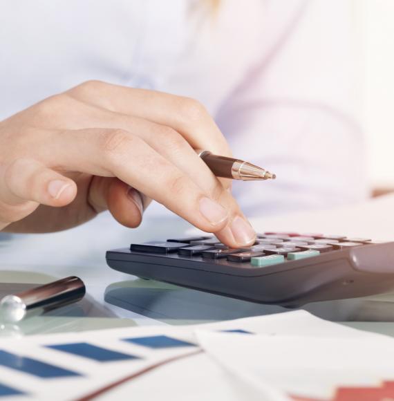 Businesswoman using calculator