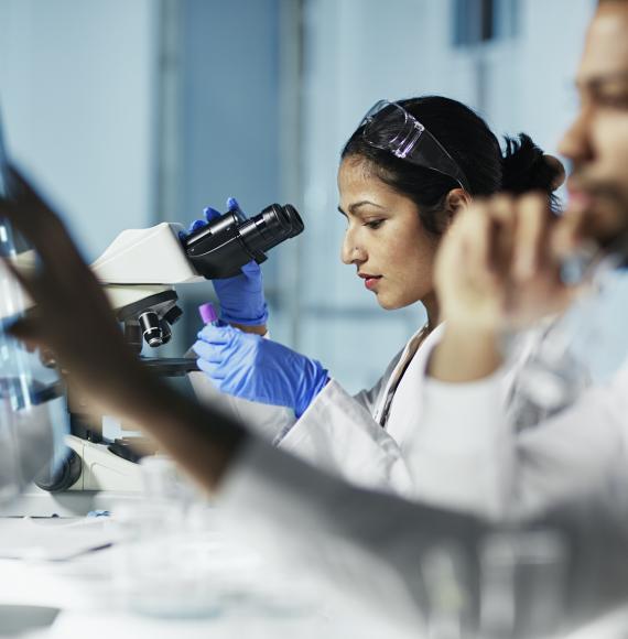 Scientist Working on Computer In Modern Laboratory