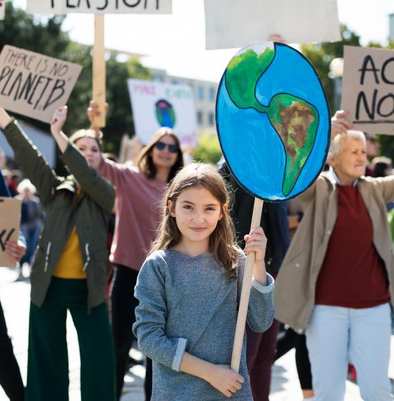 People with placards and posters on a global strike for climate change.