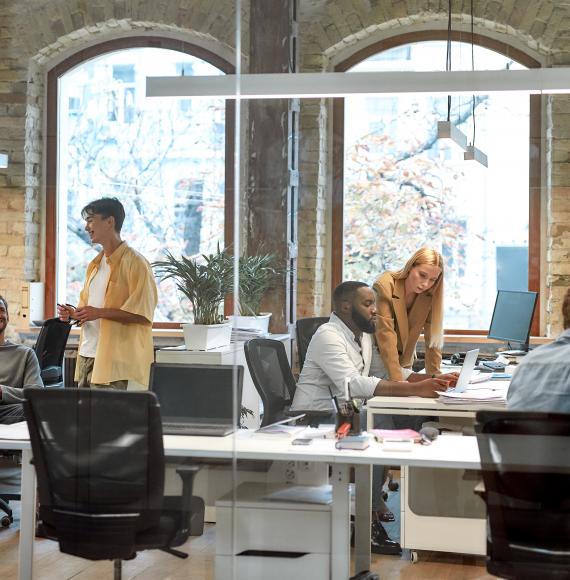 Group of mixed race business people working together in the creative office.