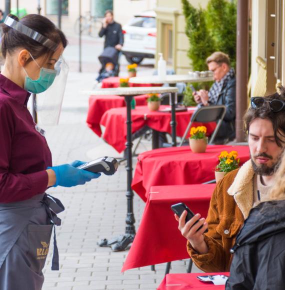 Couple being served at a bar.