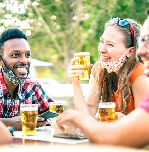 Friends laugh at dinner table