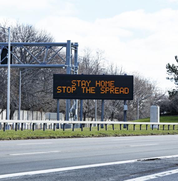 Stay home save lives sign