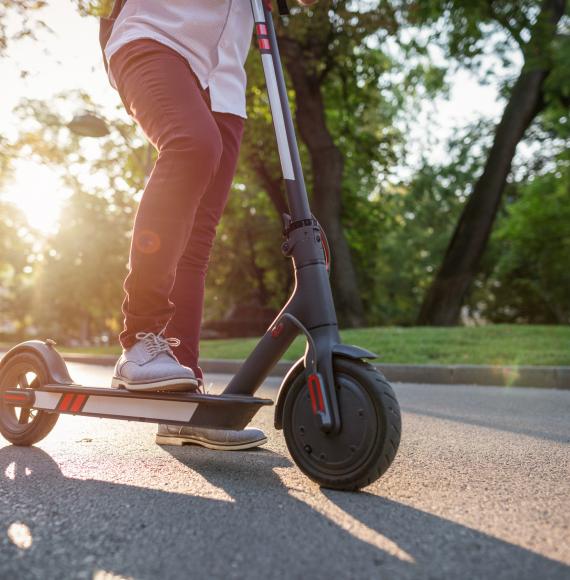 Man rides e-scooter