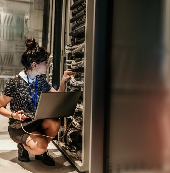 Technician in server room updating firmware.