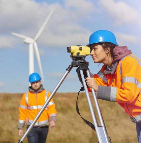 Engineers use surveying tools. 