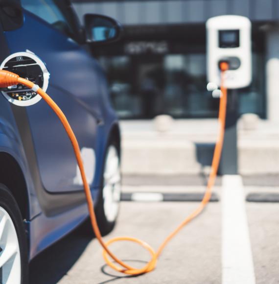 Electric vehicle parked up and charging