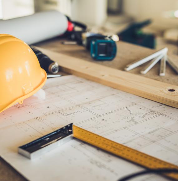 Hard hat and assorted construction items on a table