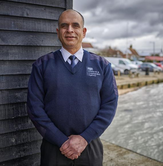 Public service worker stood on a dock