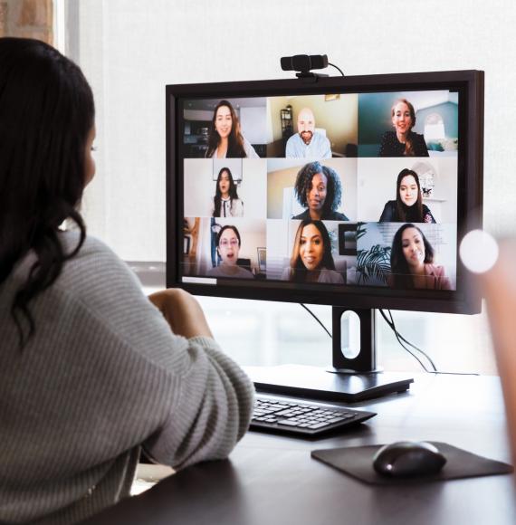 Remote worker on a video call with colleagues