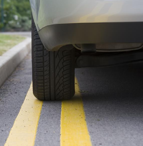 Car parked on yellow lines