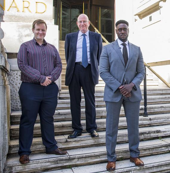 Councillor Kris Brown with new committee advisers Stephen Gregory and Ramone Johnson