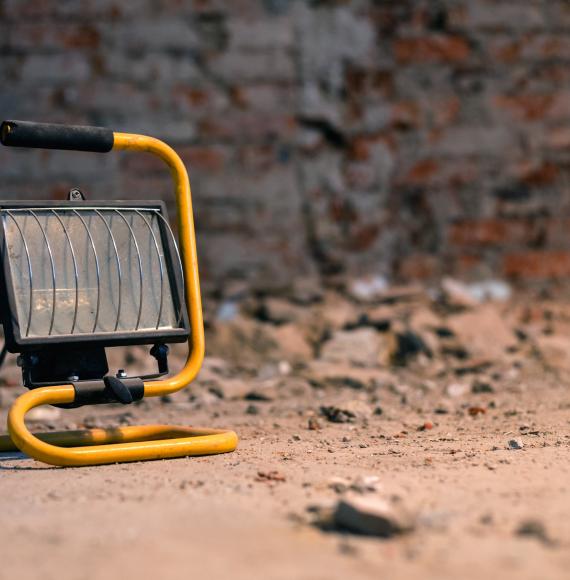 Handheld construction lamp at a building site