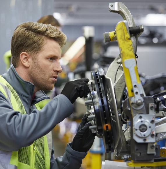 Man working on a car manufacturing plant