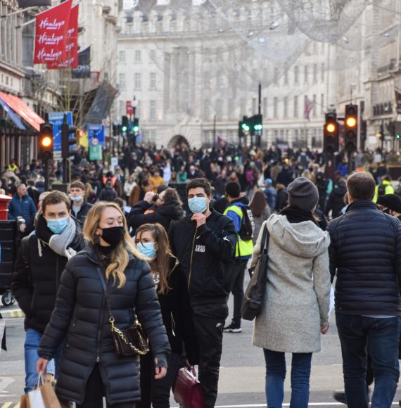 Busy London street with shoppers wearing face masks