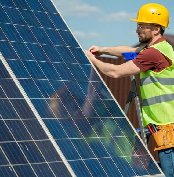 Engineer installing solar panels