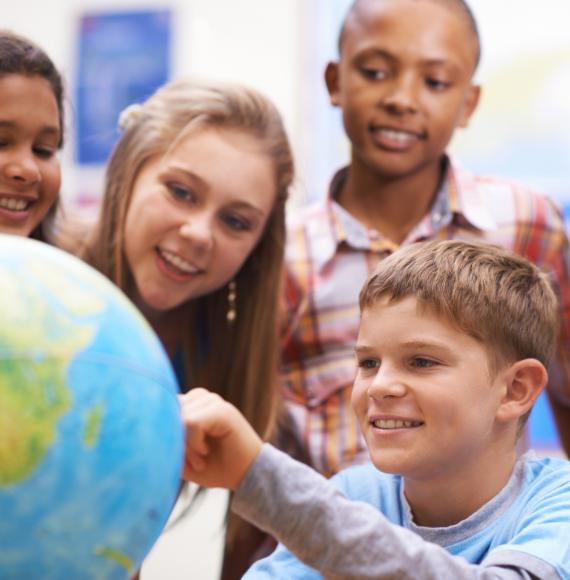 Teacher talking to young children about climate change