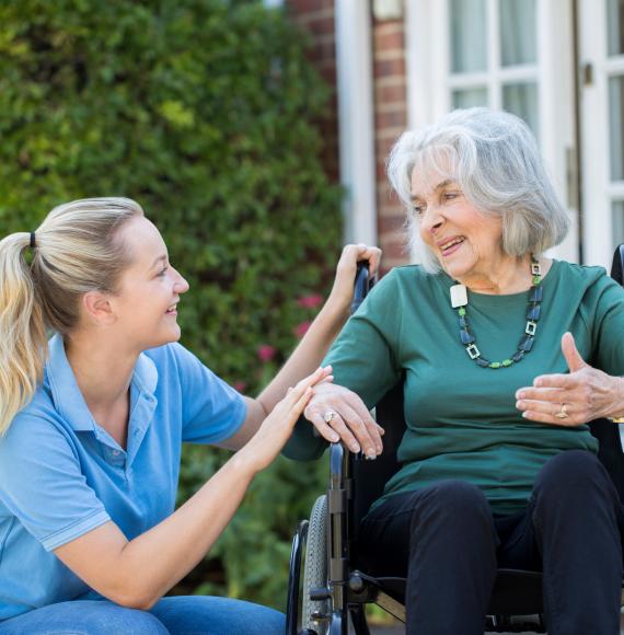 Carer and woman in wheelchair