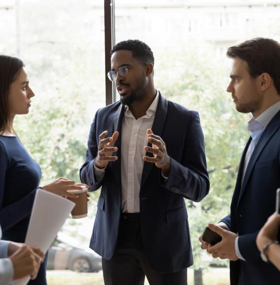 Leader speaking to colleagues