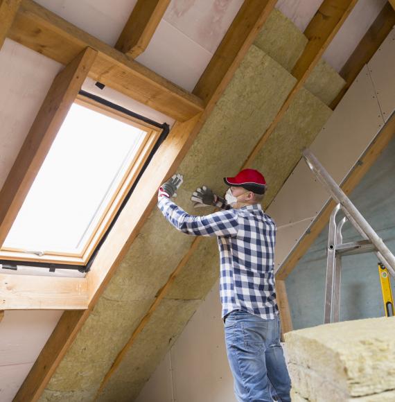 Man insulating house