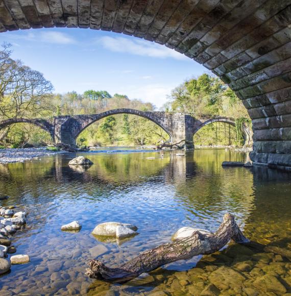 View of a river from underneath a bridge in Lancashire