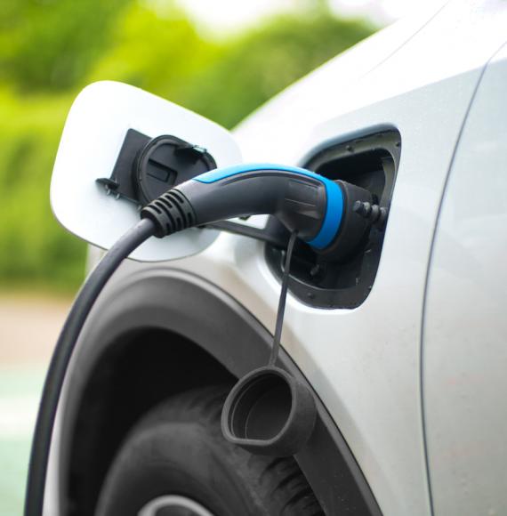 Electric Car Charging At Power Station